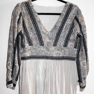 The White Dress With Intricate Floral Stitch Detailing